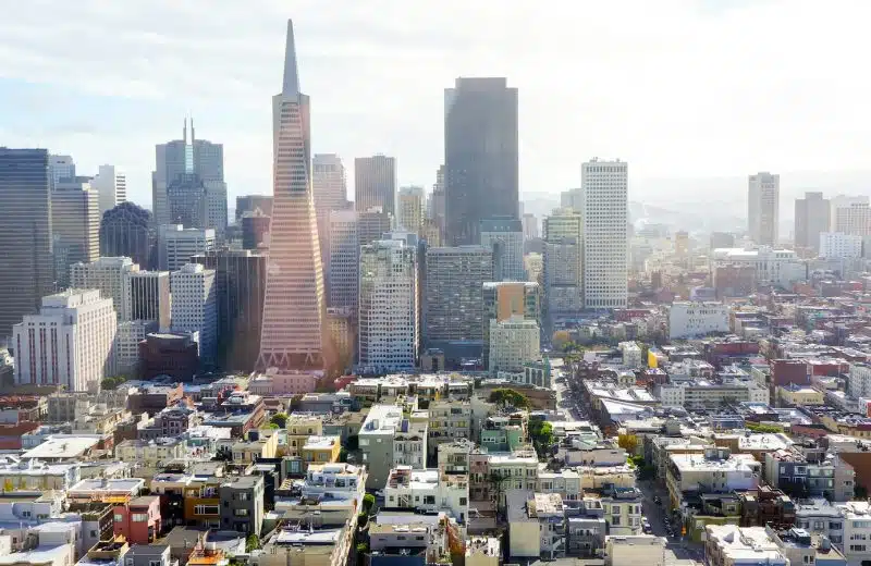 aerial photography of concrete buildings under blue cloudy sky