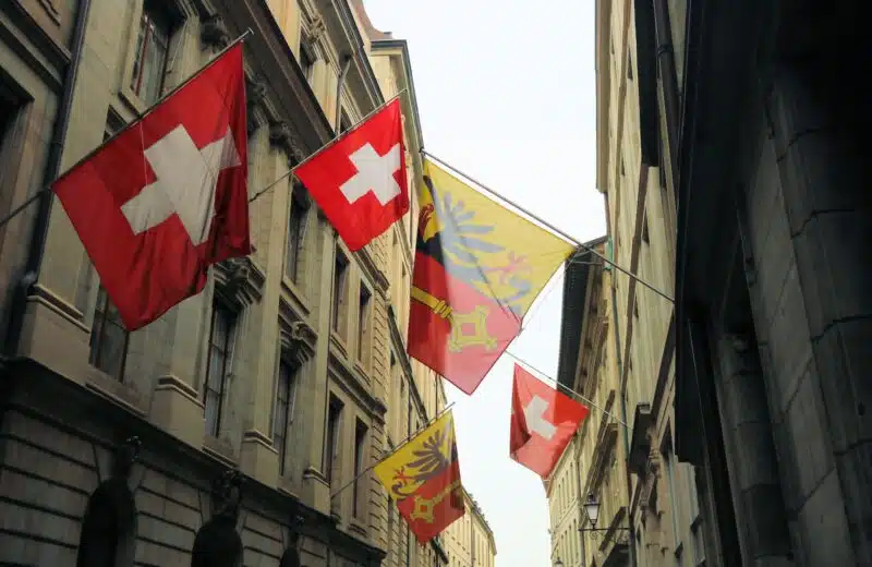 red white and yellow flags on flag pole